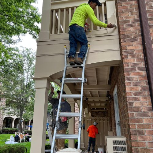 Waterproofing contractors sealing building exterior in Long Island