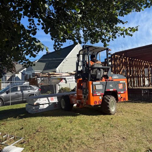Masonry repair specialists working on stone facade